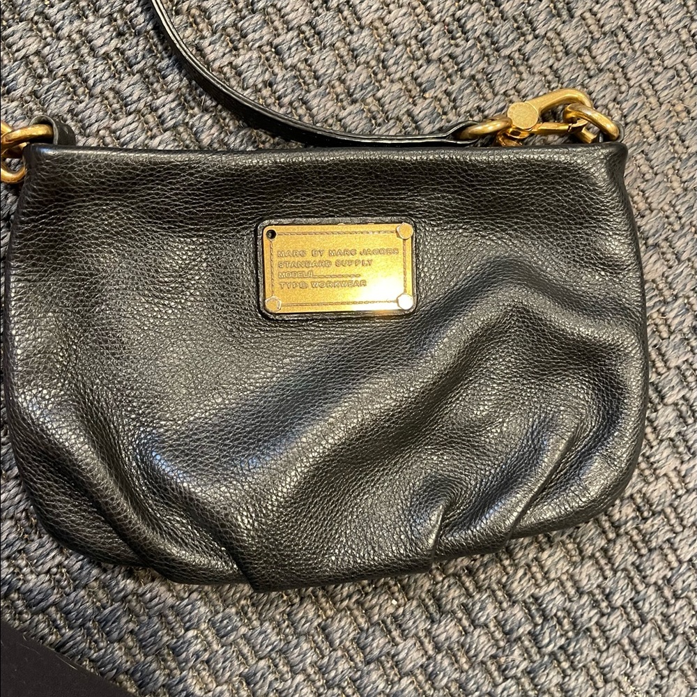 Marc by Marc Jacobs small crossbody. Black pebbled leather. Missing one screw.